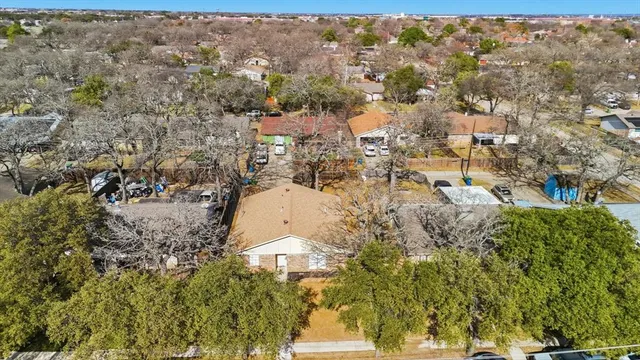 an aerial view of residential houses with city view