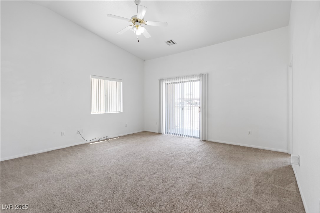 1430 Star Road Pahrump, NV 89048 - Photo 27 of 32 Unfurnished room with carpet floors, high vaulted ceiling, and a ceiling fan