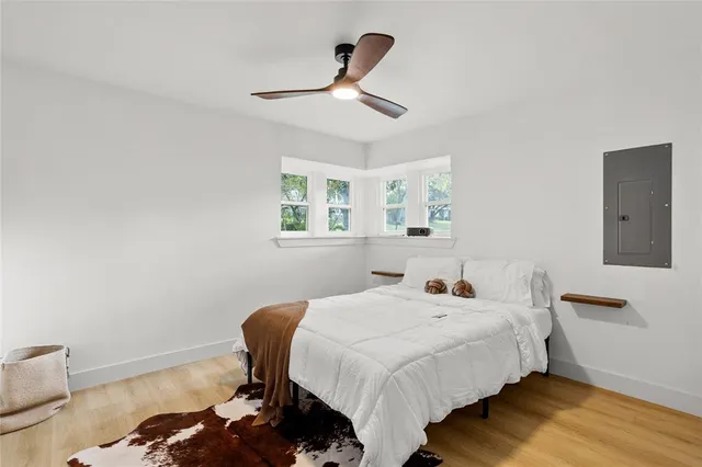 a bedroom with bed and a window