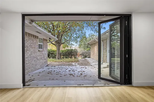 a view of a porch with a tree