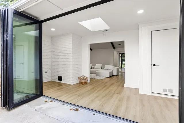 a view of a bedroom with wooden floor and bedroom