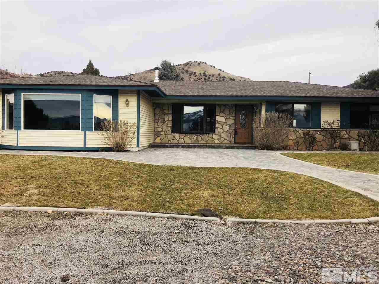 14170 Rim Rock Drive Reno, NV 89521 - Photo 1 of 25 a front view of a house with a yard