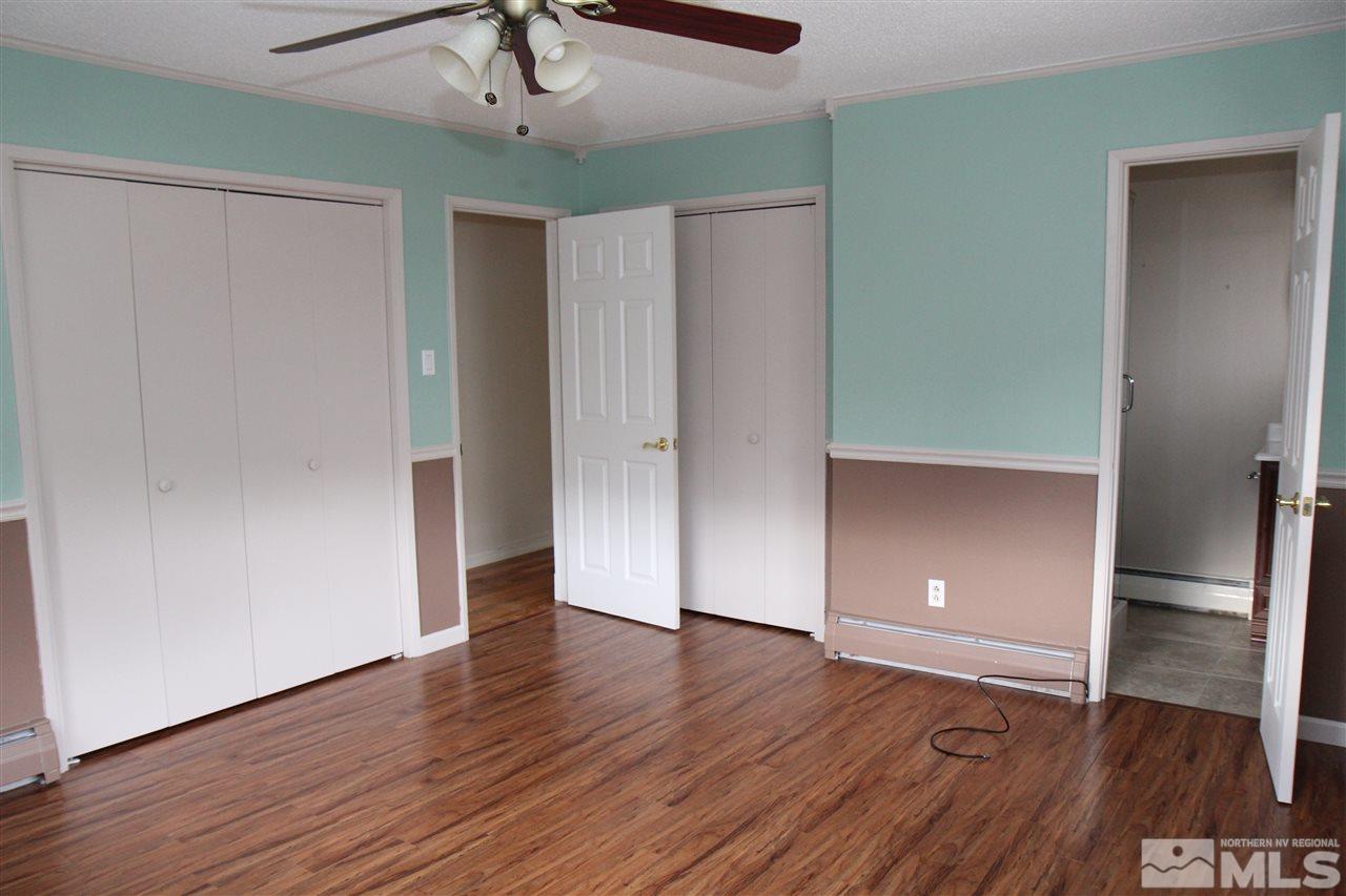 14170 Rim Rock Drive Reno, NV 89521 - Photo 16 of 25 an empty room with wooden floor and closet