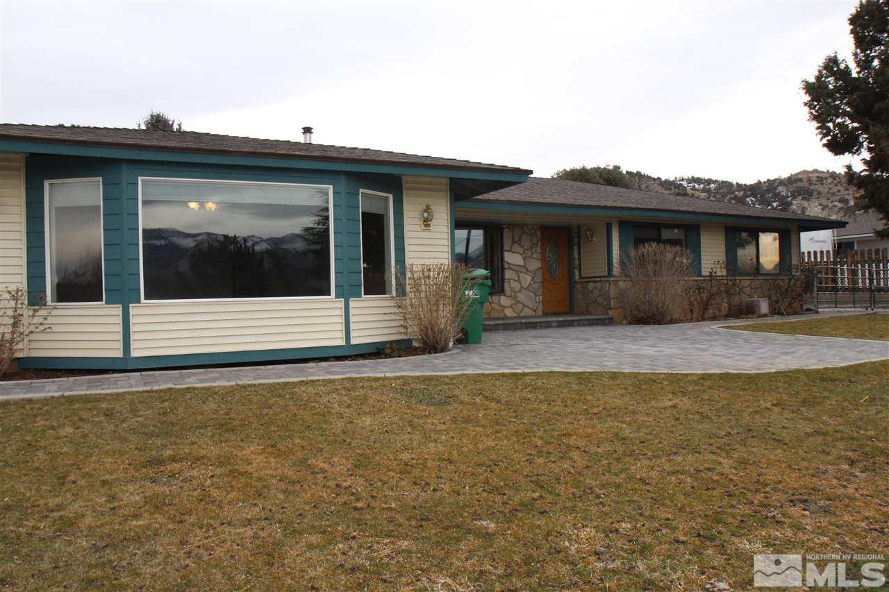 14170 Rim Rock Drive Reno, NV 89521 - Photo 23 of 25 a front view of a house with a yard