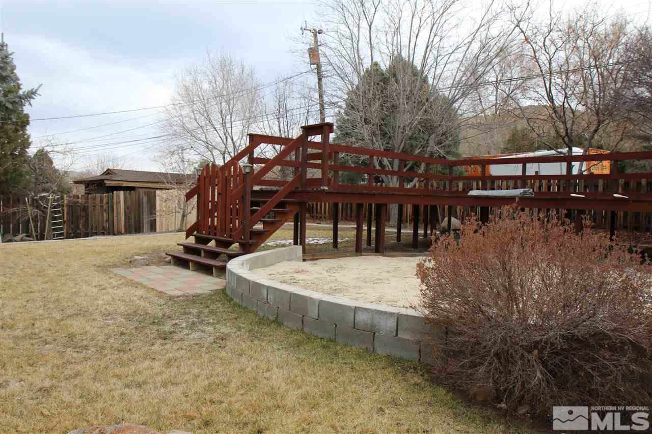14170 Rim Rock Drive Reno, NV 89521 - Photo 7 of 25 a view of a house with large trees