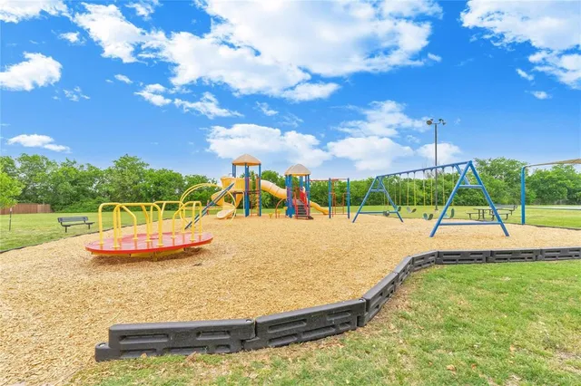 a view of a swimming pool with a yard