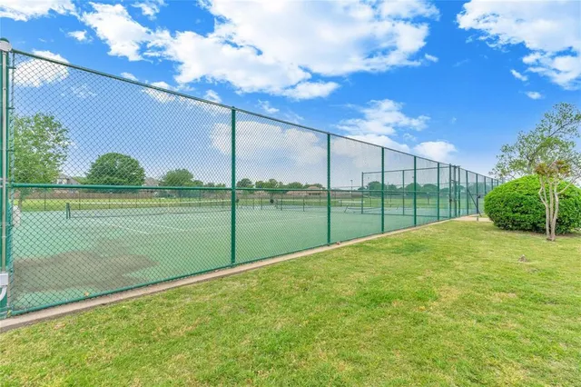 a view of a garden and basketball court