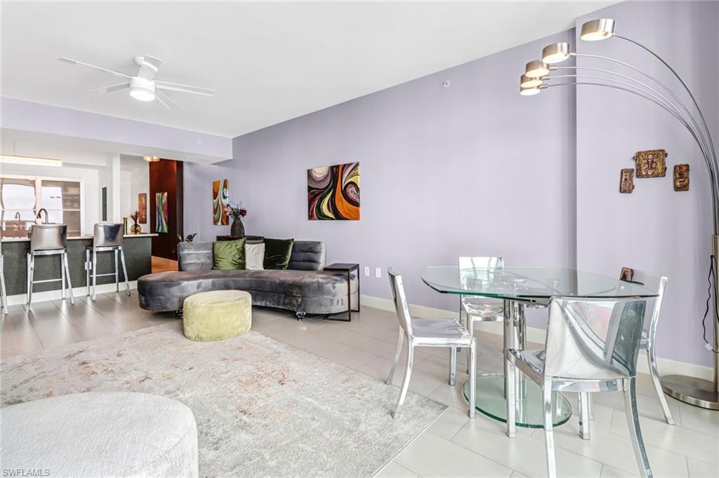3000 Oasis Grand Boulevard, Unit 2205 Fort Myers, FL 33916 - Photo 14 of 42 a living room with furniture and kitchen view