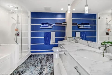 a kitchen with kitchen island granite countertop a sink and a stove