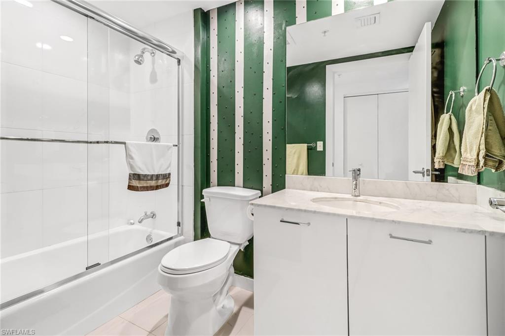 3000 Oasis Grand Boulevard, Unit 2205 Fort Myers, FL 33916 - Photo 23 of 42 a bathroom with a sink a toilet and shower
