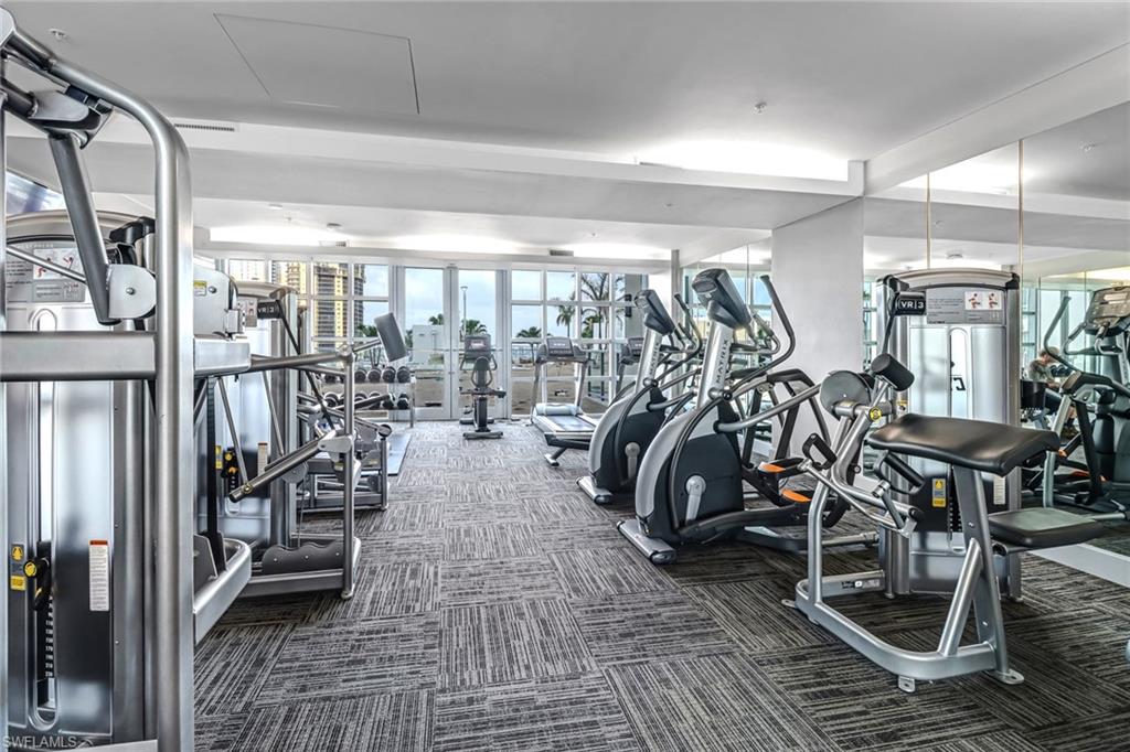 3000 Oasis Grand Boulevard, Unit 2205 Fort Myers, FL 33916 - Photo 27 of 42 a view of a room with gym equipment