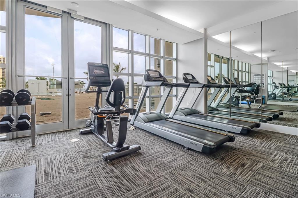3000 Oasis Grand Boulevard, Unit 2205 Fort Myers, FL 33916 - Photo 28 of 42 a view of a room with gym equipment