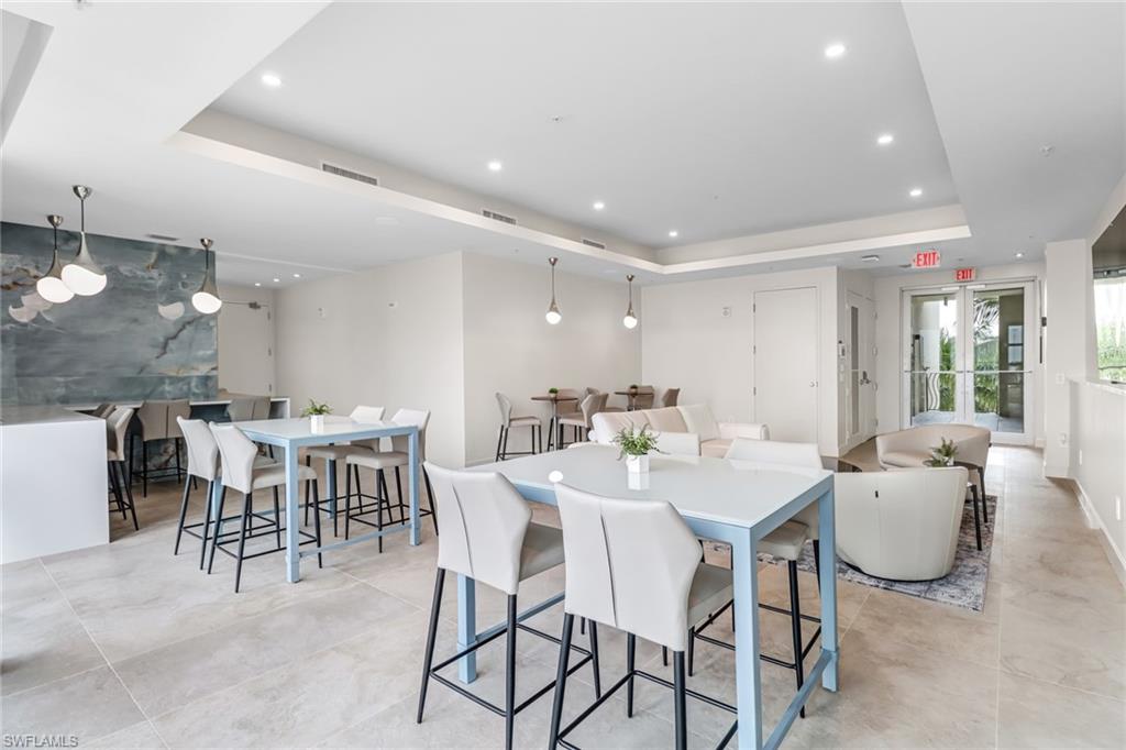 3000 Oasis Grand Boulevard, Unit 2205 Fort Myers, FL 33916 - Photo 30 of 42 a view of a dining room with furniture