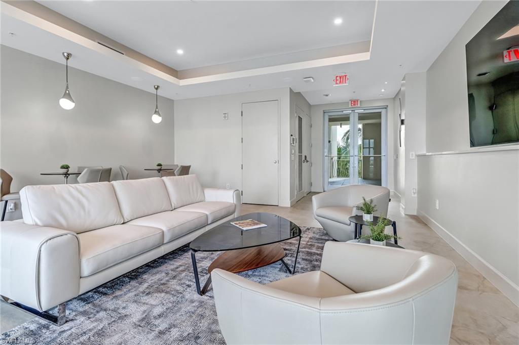 3000 Oasis Grand Boulevard, Unit 2205 Fort Myers, FL 33916 - Photo 32 of 42 a living room with furniture and a couch
