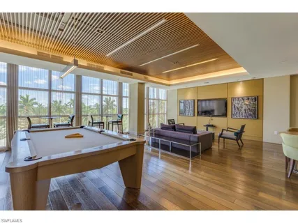 a room with furniture and wooden floor