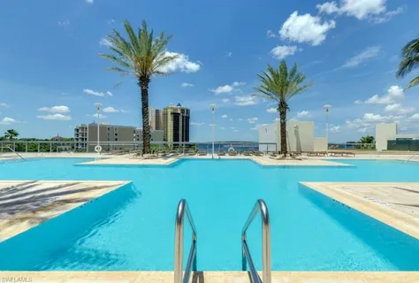 a view of a living room and kitchen