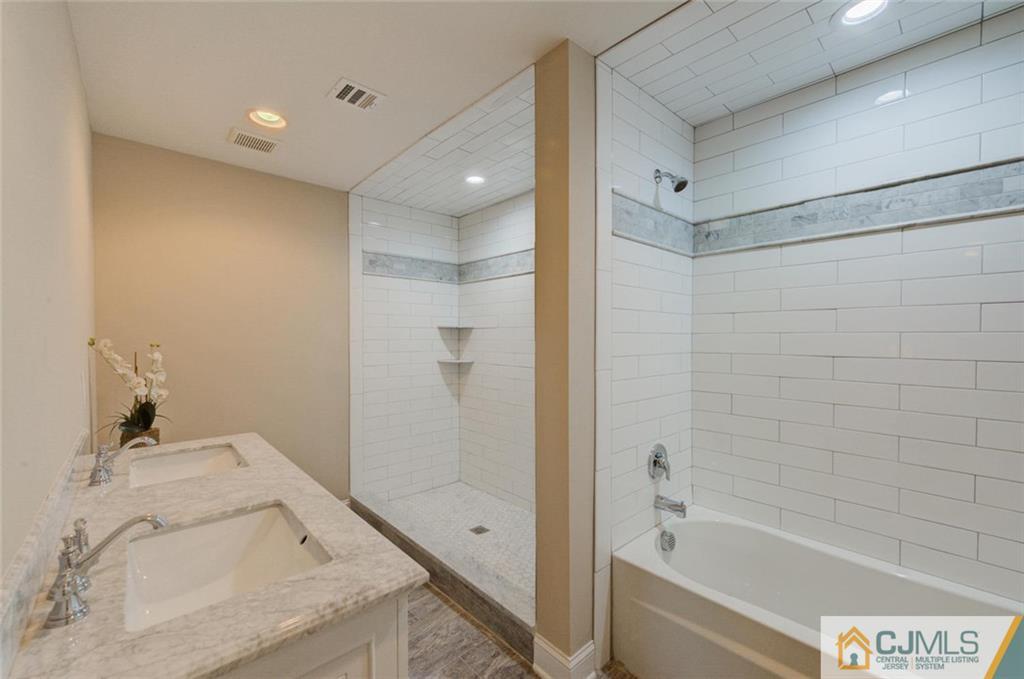 3 Homestead Road Edison, NJ 08820 - Photo 22 of 25 a bathroom with a granite countertop sink a bathtub and shower