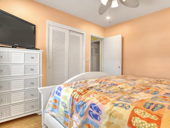 a bedroom with a bed and cabinets