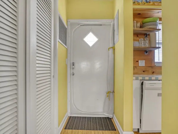 a view of a bathroom from a hallway