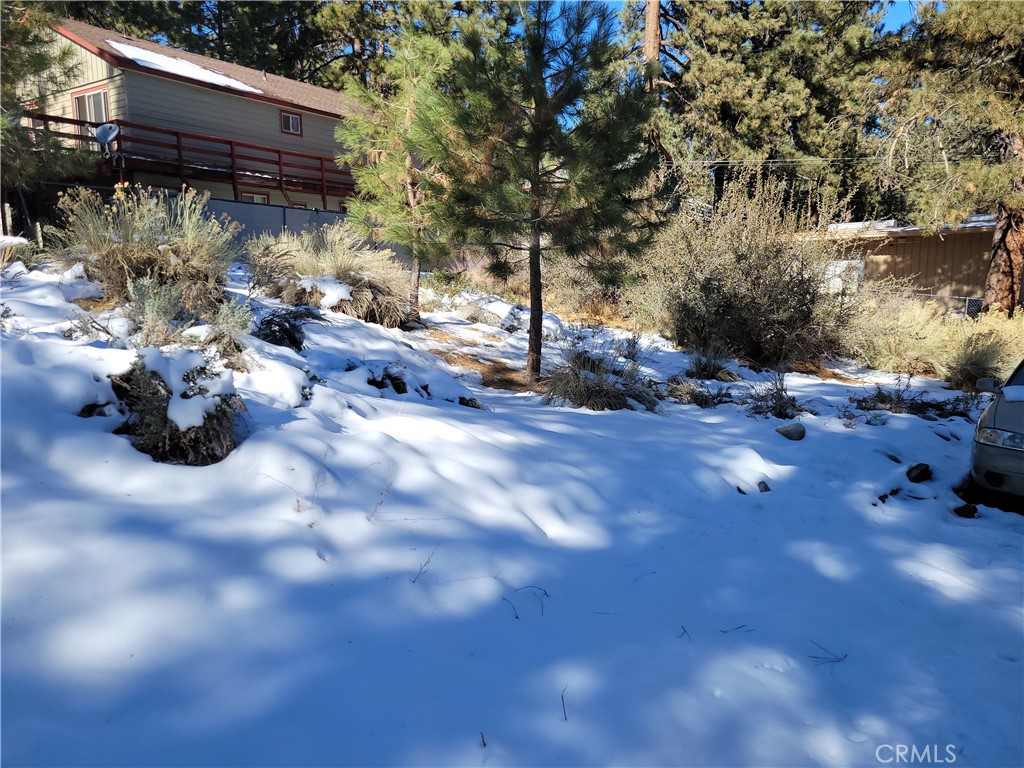 0 Blackbird Road Wrightwood, CA 92397 - Photo 5 of 13 a backyard of a house with table and chairs