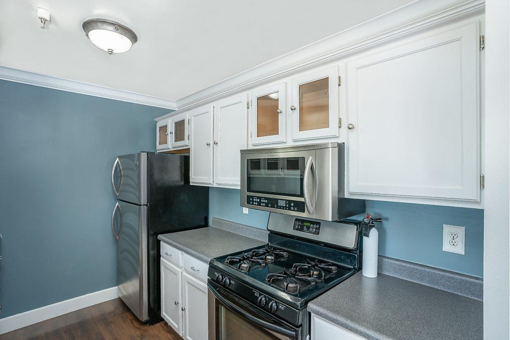 532 Monterey Road Pacifica, CA 94044 - Photo 12 of 41 a kitchen with stainless steel appliances a stove a microwave and a refrigerator