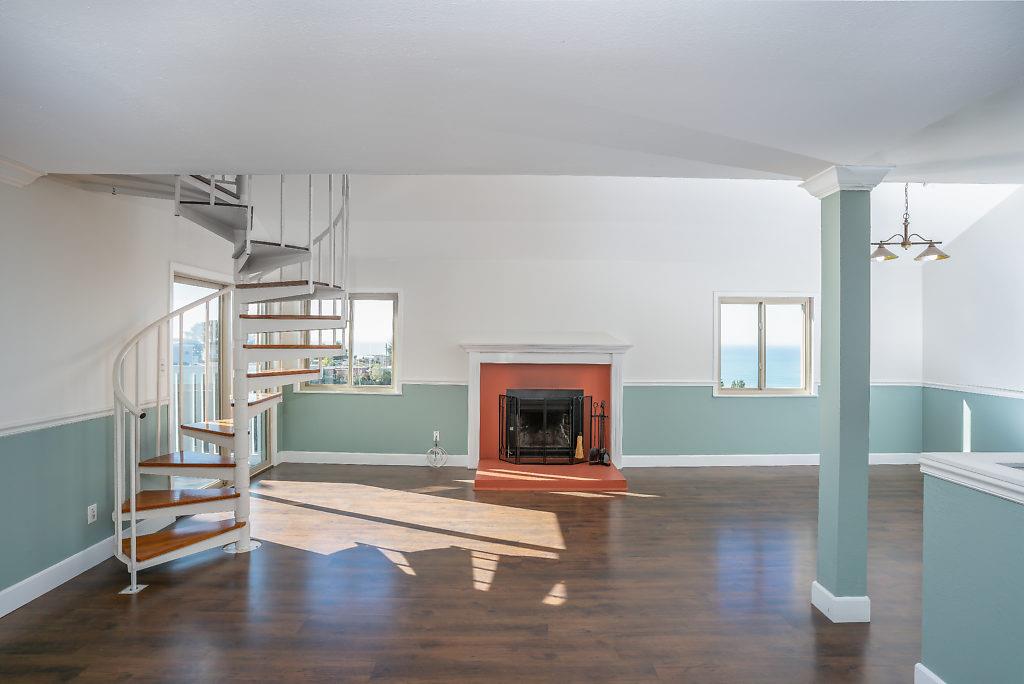 532 Monterey Road Pacifica, CA 94044 - Photo 7 of 41 a living room with furniture and a fireplace