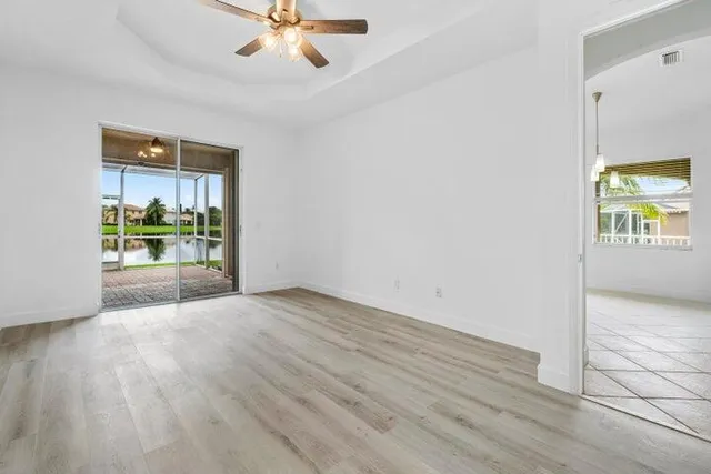 a view of a house with backyard and porch