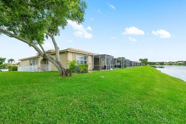 a living room with furniture gym equipment and a large window