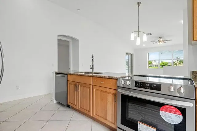 a kitchen with a sink and a microwave