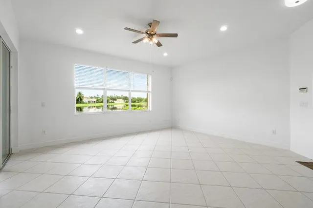 a view of a kitchen with a sink and a window