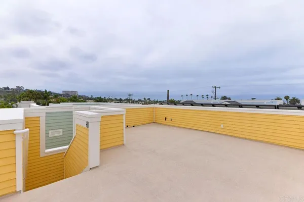 a view of a swimming pool with an outdoor seating