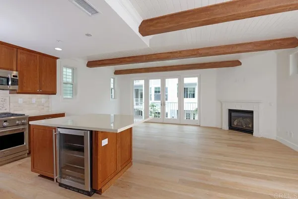 a kitchen with a stove and a cabinet