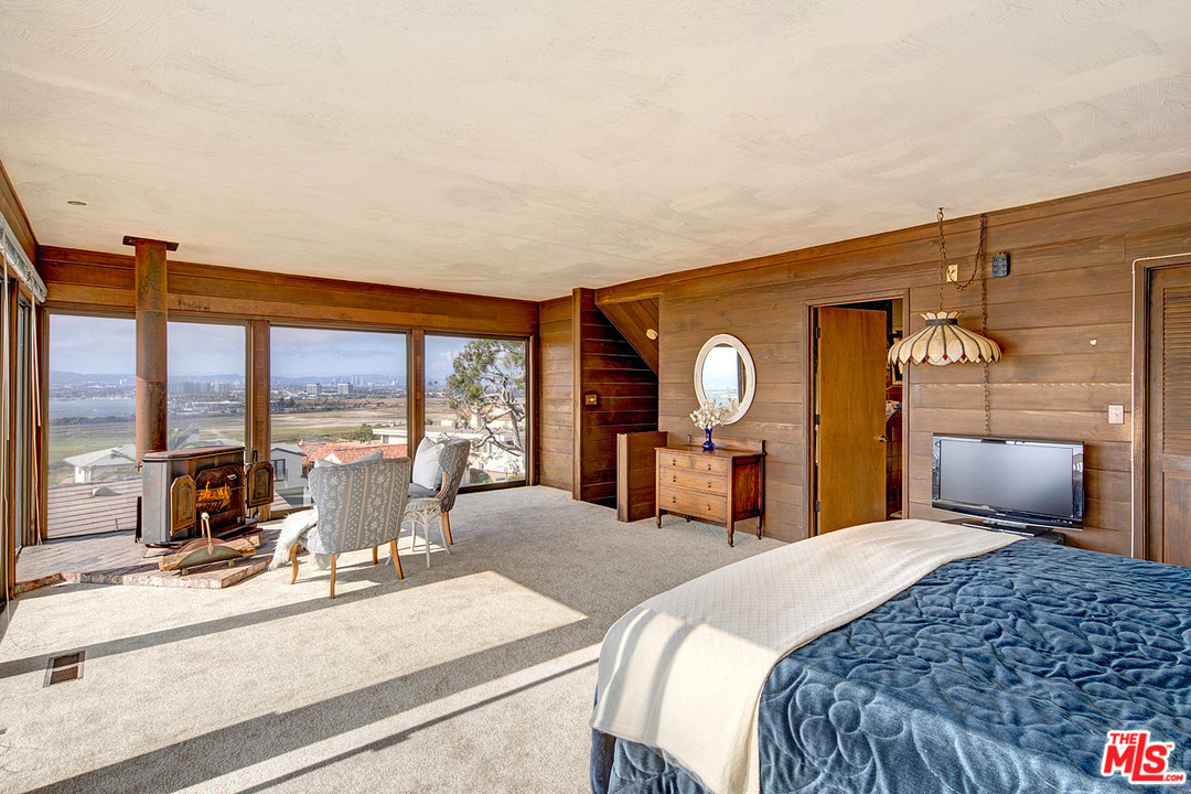 249 Fowling Street Playa del Rey, CA 90293 - Photo 17 of 40 a bedroom with a bed and large windows