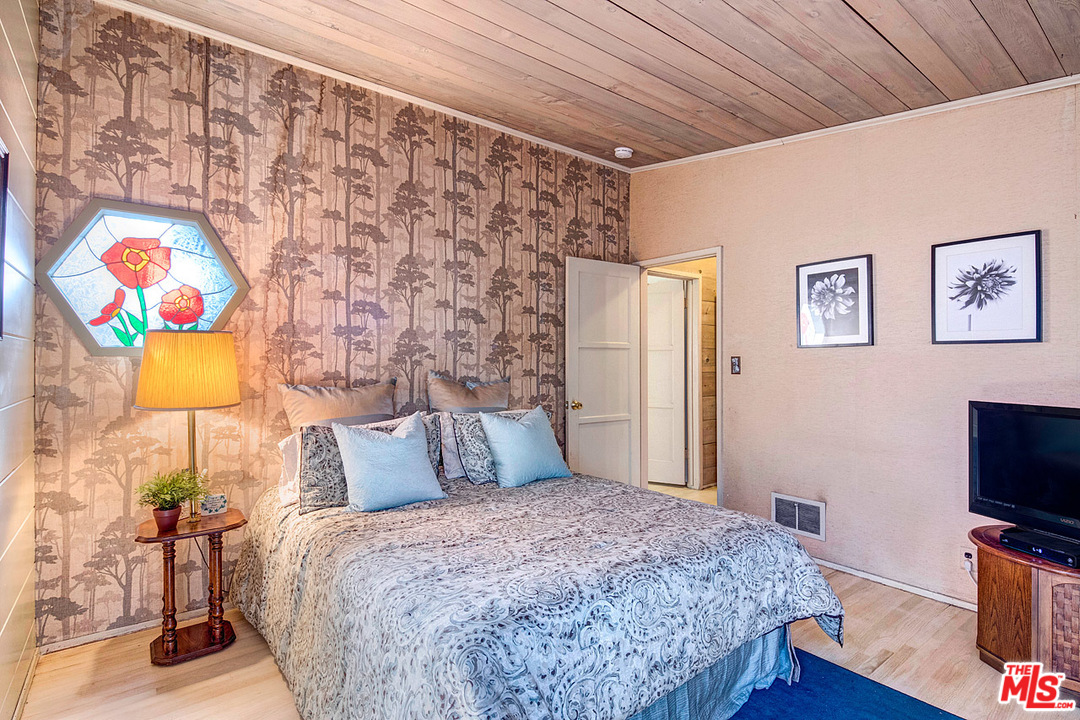 249 Fowling Street Playa del Rey, CA 90293 - Photo 24 of 40 a bedroom with a bed and a flat screen tv