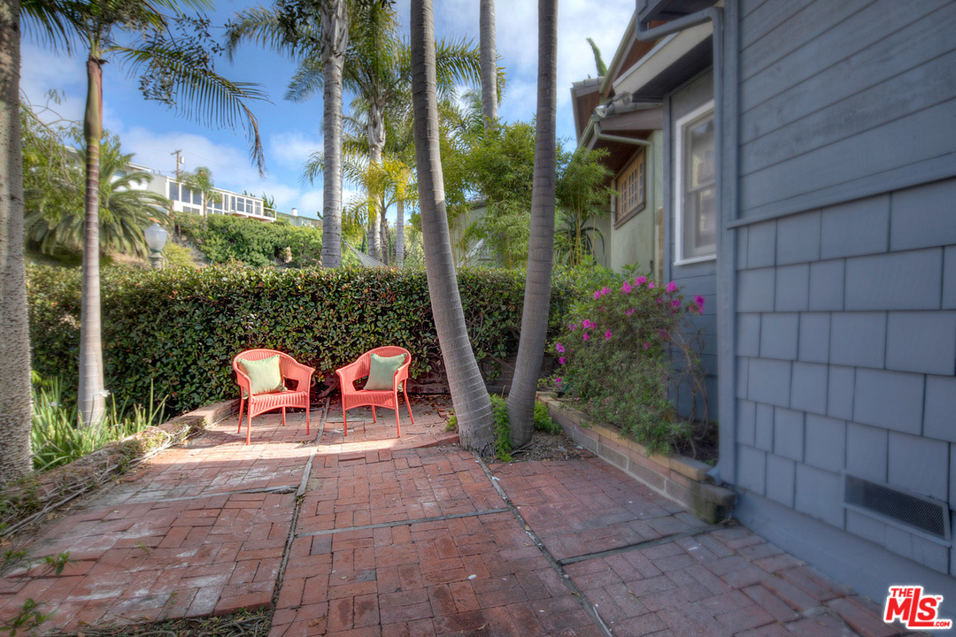 249 Fowling Street Playa del Rey, CA 90293 - Photo 27 of 40 a view of a patio with table and chairs and potted plants