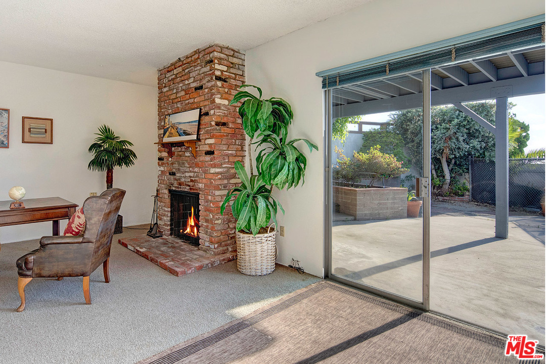 249 Fowling Street Playa del Rey, CA 90293 - Photo 30 of 40 a living room with furniture a patio and a glass door