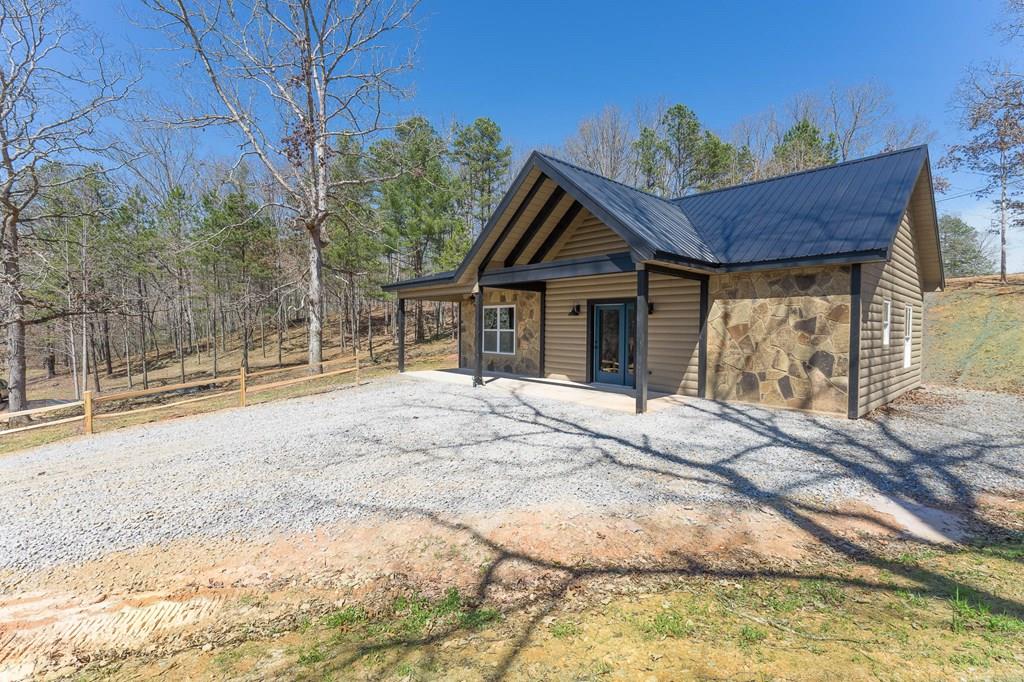 304 Old Evans Road Murphy, NC 28906 - Photo 1 of 31 a view of wooden house with a yard