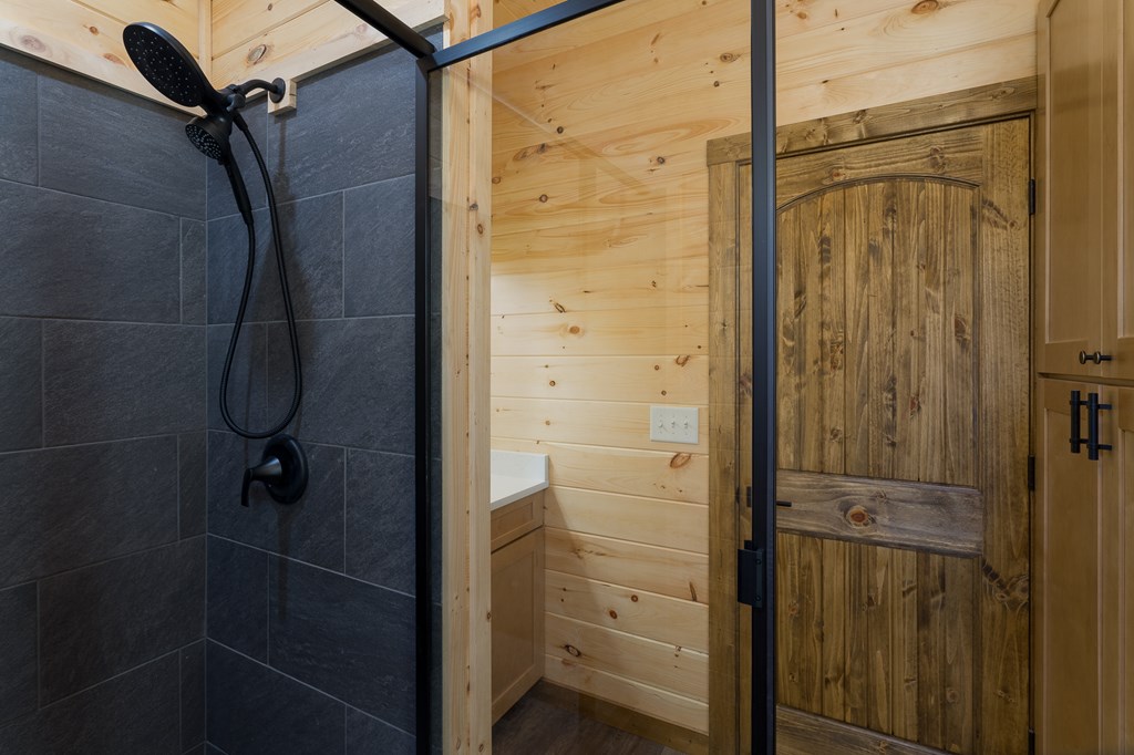 304 Old Evans Road Murphy, NC 28906 - Photo 13 of 31 a bathroom with a glass shower door