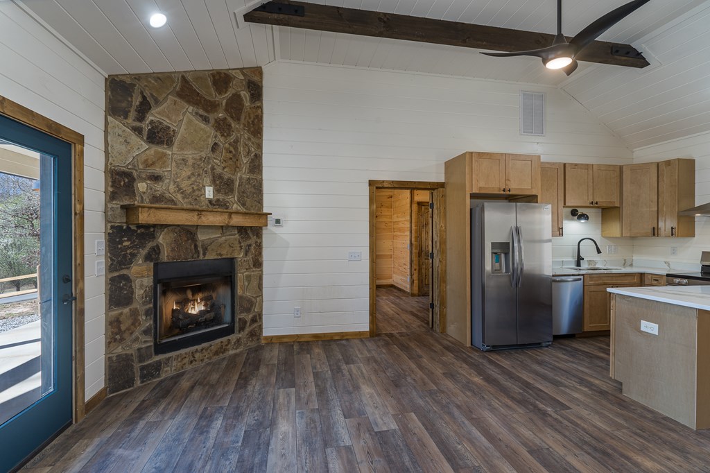 304 Old Evans Road Murphy, NC 28906 - Photo 21 of 31 a kitchen with stainless steel appliances a stove refrigerator and a fireplace