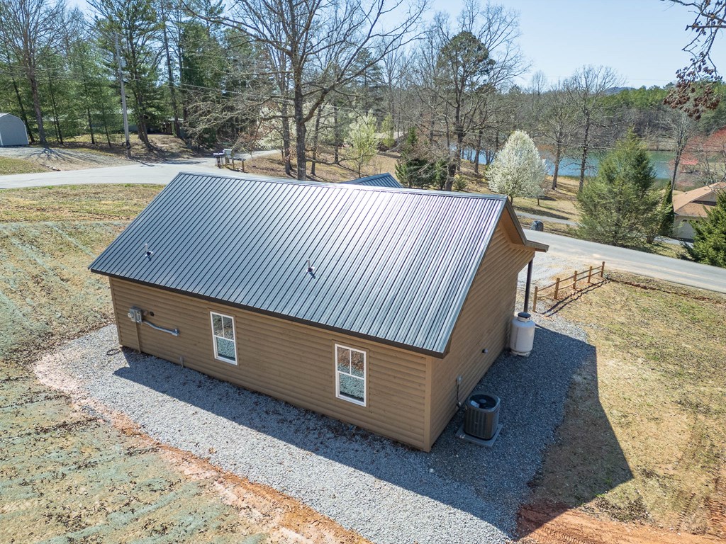 304 Old Evans Road Murphy, NC 28906 - Photo 5 of 31 a view of roof deck with large trees and wooden fence