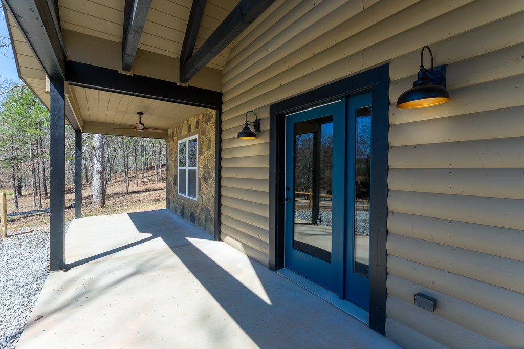 304 Old Evans Road Murphy, NC 28906 - Photo 8 of 31 a view of a porch with a door and wooden floor