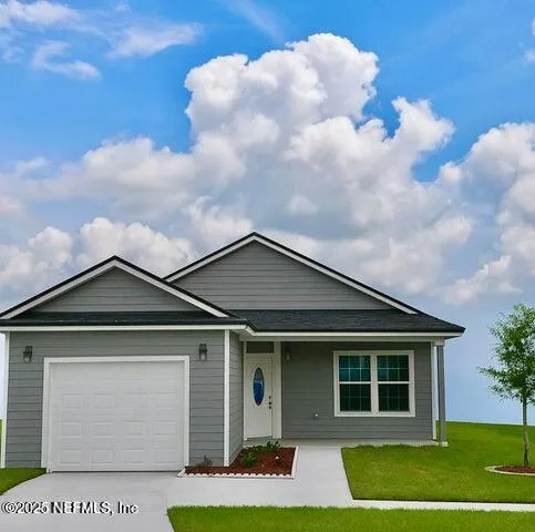 a front view of a house with a yard