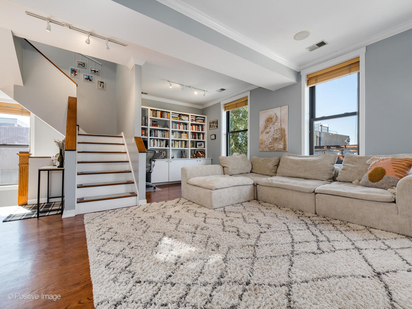2075 North Oakley Avenue, Unit 3F Chicago, IL 60647 - Photo 11 of 24 a living room with furniture and wooden floor