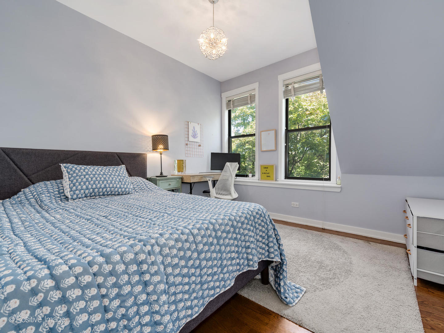 2075 North Oakley Avenue, Unit 3F Chicago, IL 60647 - Photo 18 of 24 a bedroom with a bed and a window