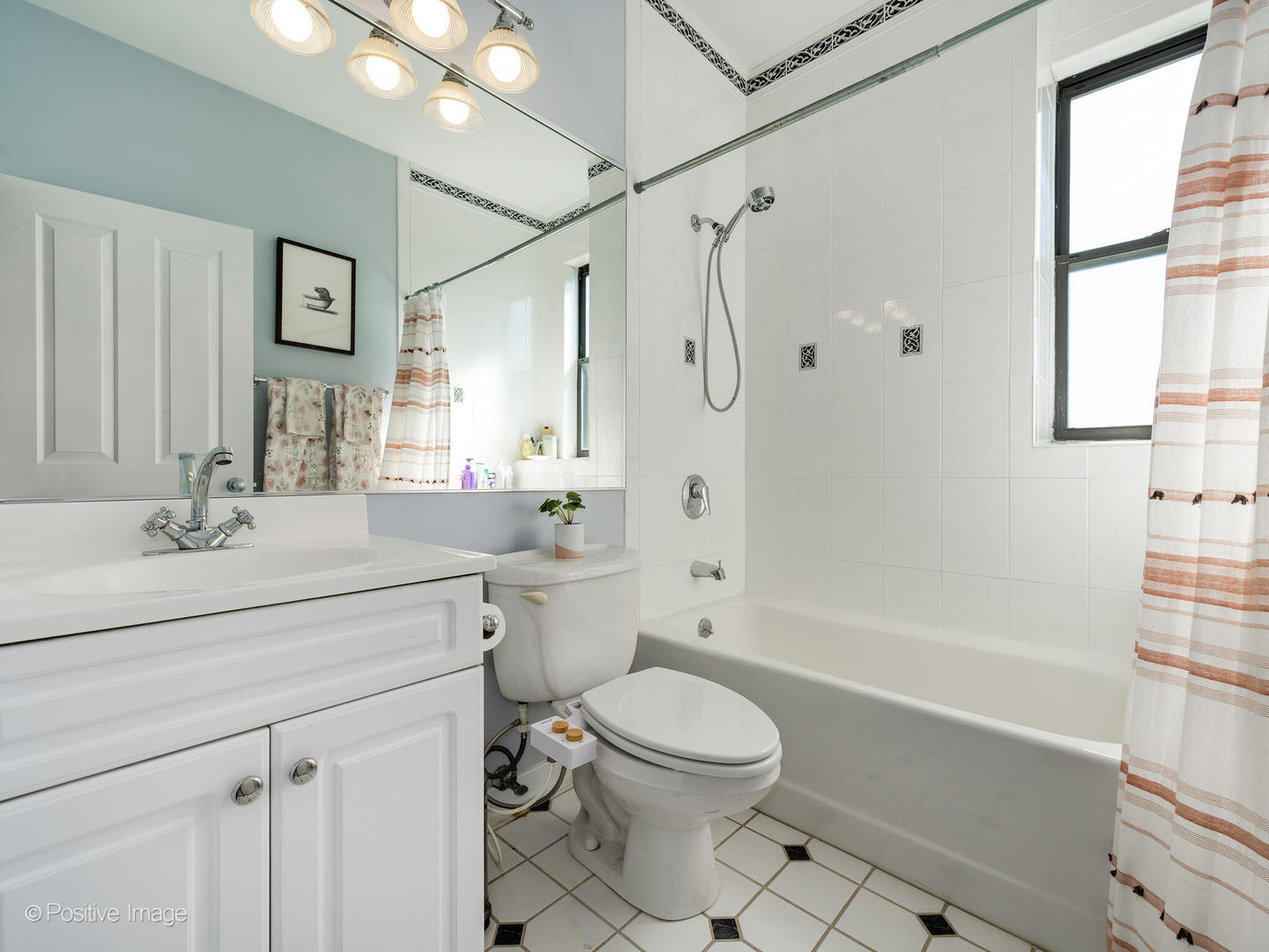 2075 North Oakley Avenue, Unit 3F Chicago, IL 60647 - Photo 19 of 24 a bathroom with a sink a toilet and shower