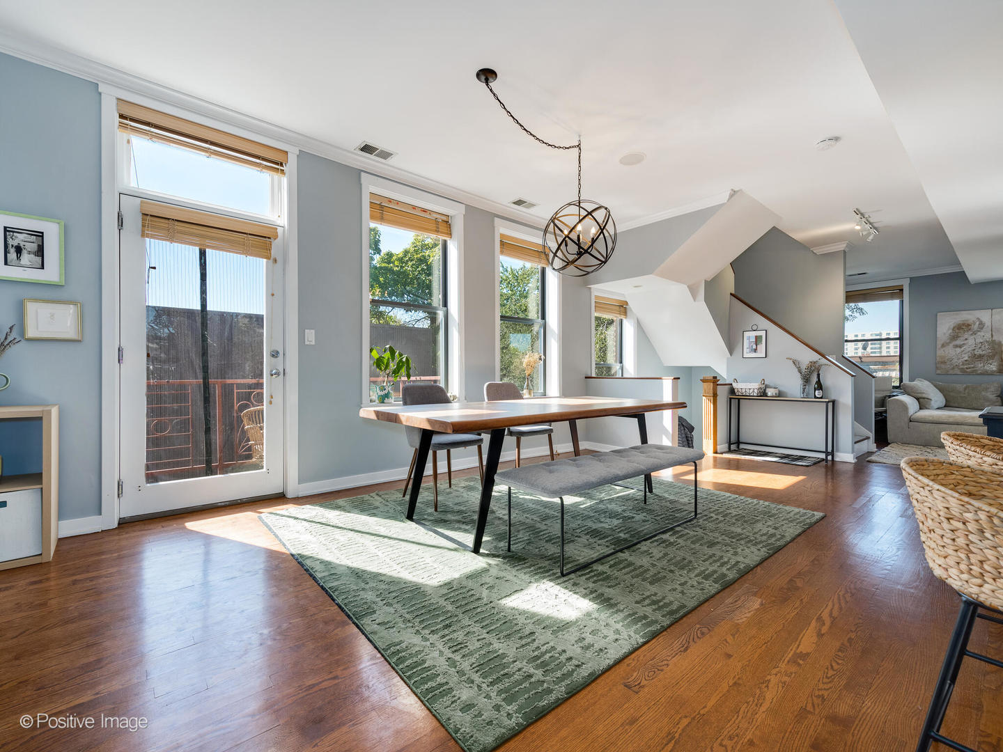 2075 North Oakley Avenue, Unit 3F Chicago, IL 60647 - Photo 2 of 24 a view of a livingroom with wooden floor and furniture