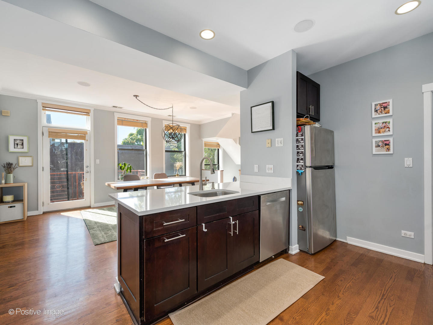 2075 North Oakley Avenue, Unit 3F Chicago, IL 60647 - Photo 6 of 24 a spacious bathroom with a granite countertop sink and a large mirror