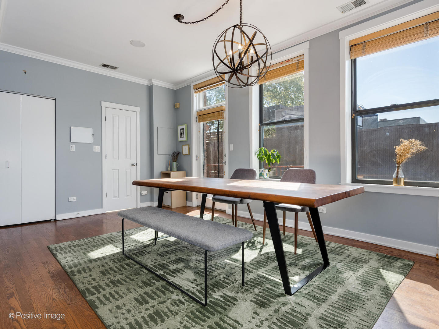 2075 North Oakley Avenue, Unit 3F Chicago, IL 60647 - Photo 8 of 24 a view of a dining room with furniture window and wooden floor