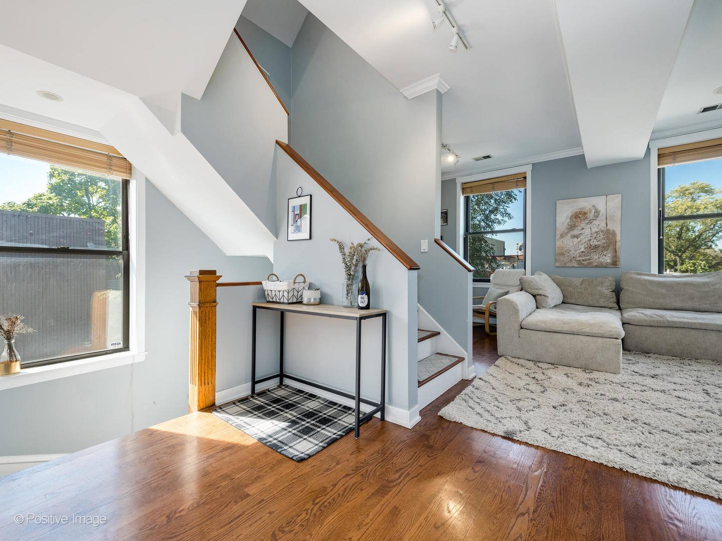 2075 North Oakley Avenue, Unit 3F Chicago, IL 60647 - Photo 9 of 24 a living room with furniture and a window
