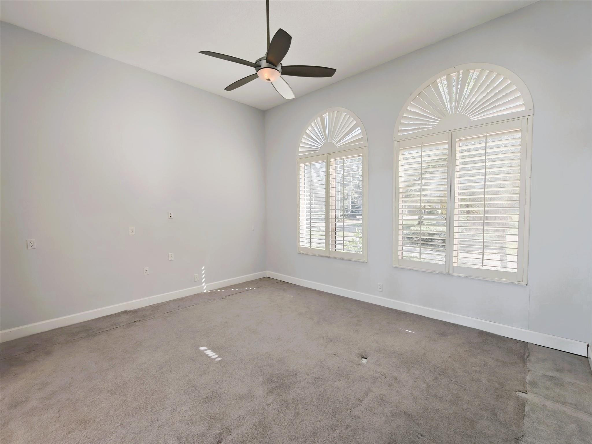 2939 Paddock Lane Weston, FL 33331 - Photo 15 of 86 an empty room with windows and fan